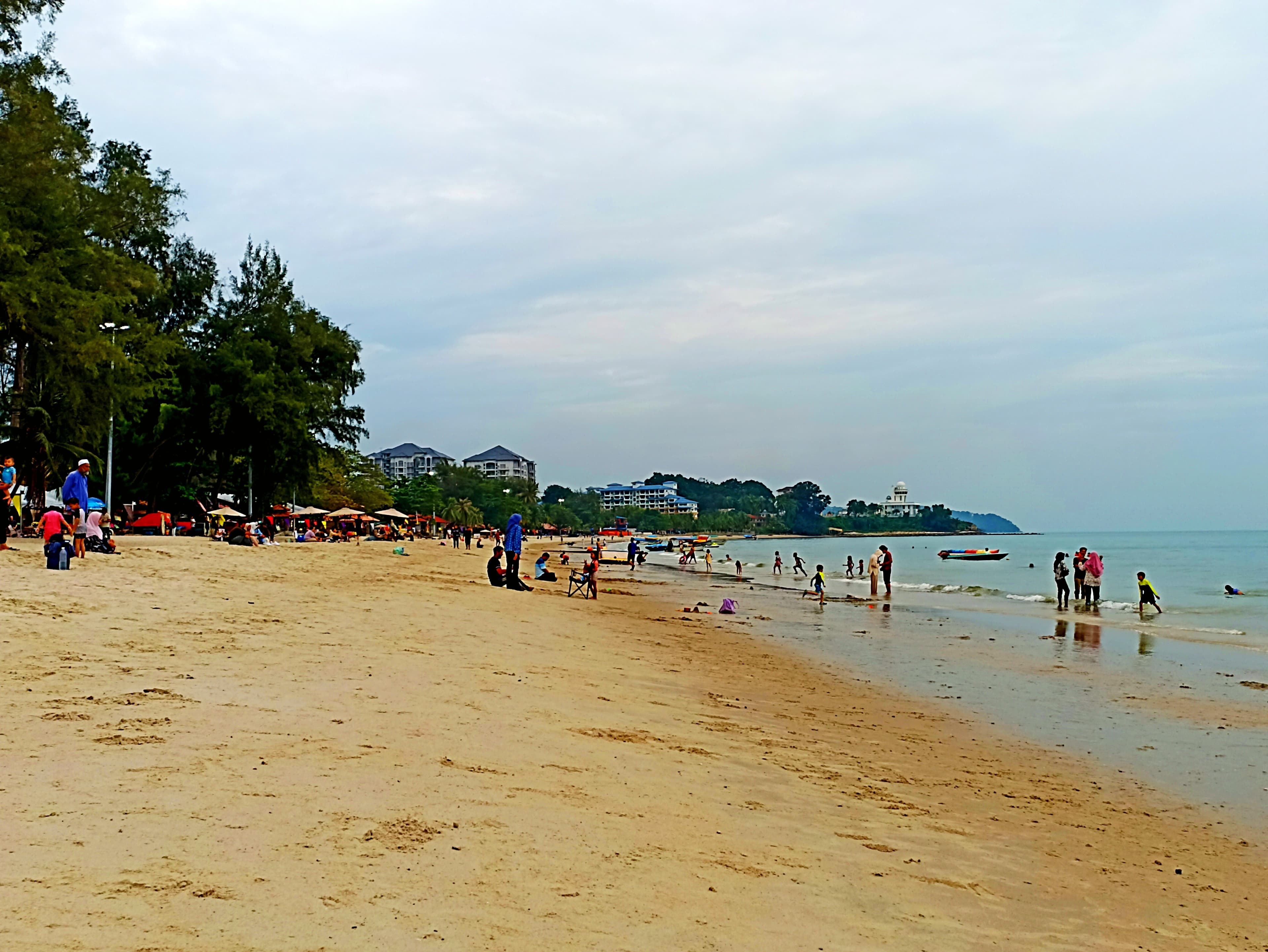 People enjoying Teluk Kemang Beach in Port Dickson